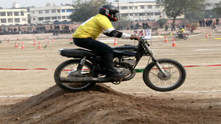 Biker making a valiant attempt to cross a hurdle during 10th Speed Mobike Dirt Track Racing C'ship in Jammu on Thursday. —Excelsior/Rakesh Biker making a valiant attempt to cross a hurdle during 10th Speed Mobike Dirt Track Racing C'ship in Jammu on Thursday. —Excelsior/Rakesh