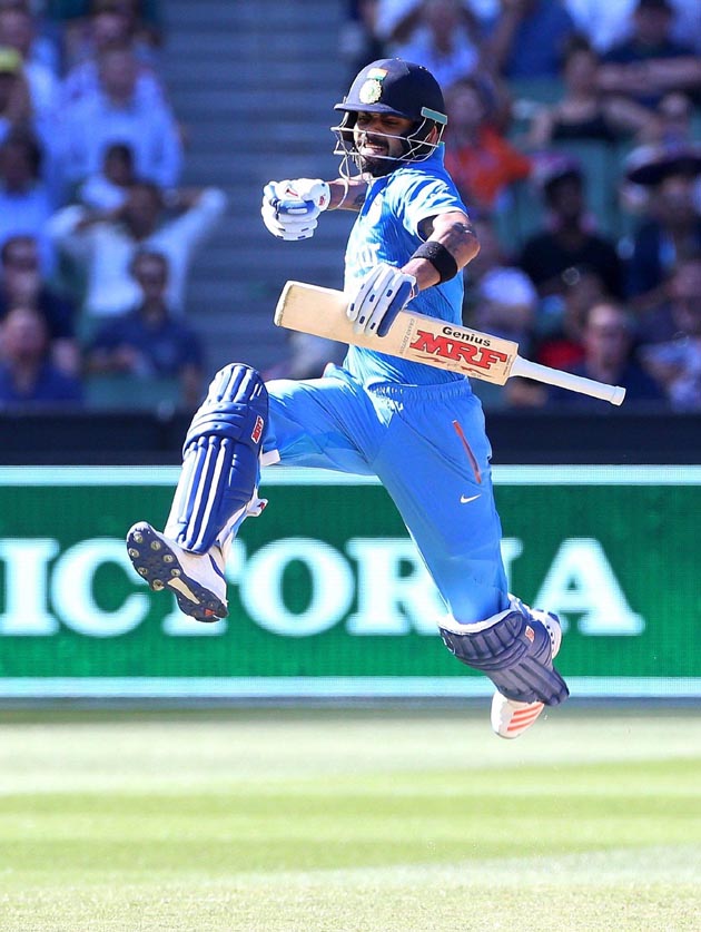 India's Virat Kohli celebrates his century against Australia during their One Day cricket match at the Melbourne Cricket Ground