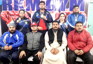 Medal winners in Bench-Press Powerlifting & Deadlift Championship posing alongwith dignitaries during felicitation function at Jammu on Wednesday. Medal winners in Bench-Press Powerlifting & Deadlift Championship posing alongwith dignitaries during felicitation function at Jammu on Wednesday.