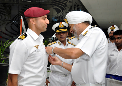 Squadron Commander Anil Raina being decorated by Commander-in-Chief. Squadron Commander Anil Raina being decorated by Commander-in-Chief.