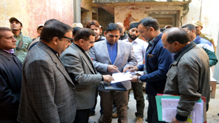 MLA, R S Pura Dr Gagan Bhagat and others reviewing the functioning of Municipal Committee on Friday. MLA, R S Pura Dr Gagan Bhagat and others reviewing the functioning of Municipal Committee on Friday.