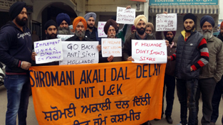 Sikh members holding protest against French President in Jammu on Sunday. Sikh members holding protest against French President in Jammu on Sunday.