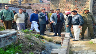 MLA R S Pura, Dr Gagan Bhagat inspecting lanes and drains at village Chohala in R S Pura. MLA R S Pura, Dr Gagan Bhagat inspecting lanes and drains at village Chohala in R S Pura.