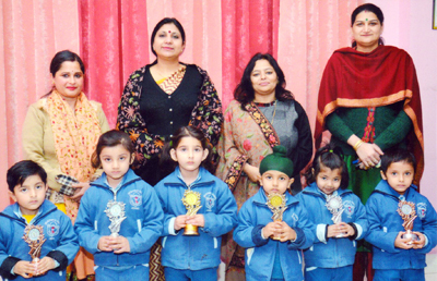 Winners of Hindi Recitation Competition posing alongwith Principal and Headmistress at DPS School in Jammu. Winners of Hindi Recitation Competition posing alongwith Principal and Headmistress at DPS School in Jammu.