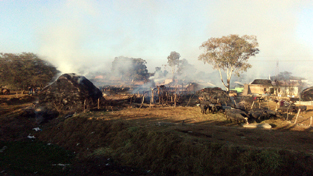 Temporary sheds of Gujjars in flame at Sarore Adda on Monday. -Excelsior/Gautam Temporary sheds of Gujjars in flame at Sarore Adda on Monday. -Excelsior/Gautam