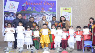 Tiny toddlers displaying certificates while posing for a group photograph with dignitaries at Jammu on Sunday. Tiny toddlers displaying certificates while posing for a group photograph with dignitaries at Jammu on Sunday.