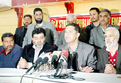 EJAC leader Qayoom Wani, flanked by PSEWF leaders Haji Bashir and Wajahat Hussain addressing press conference in Jammu. -Excelsior/Rakesh EJAC leader Qayoom Wani, flanked by PSEWF leaders Haji Bashir and Wajahat Hussain addressing press conference in Jammu. -Excelsior/Rakesh