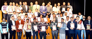 Union Minister Dr Jitendra Singh, flanked by senior officers in the Ministry of Personnel, posing for a group photograph with the recipients of Union Minister Dr Jitendra Singh, flanked by senior officers in the Ministry of Personnel, posing for a group photograph with the recipients of