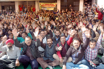 PHE employees staging protest dharna at PHE complex BC Road in Jammu on Monday. —Excelsior/ Rakesh PHE employees staging protest dharna at PHE complex BC Road in Jammu on Monday. —Excelsior/ Rakesh