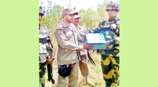 BSF and Rangers exchange sweets along IB in Samba sector.
