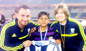 Young footballer Rishi Rajput posing alongwith football coaches. Young footballer Rishi Rajput posing alongwith football coaches.