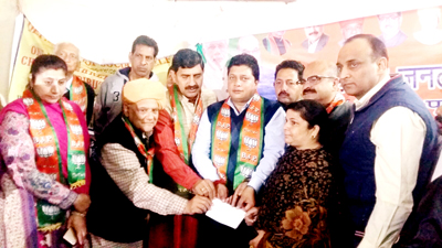 BJP leaders handing over a cheque to a woman at Jammu on Saturday. BJP leaders handing over a cheque to a woman at Jammu on Saturday.