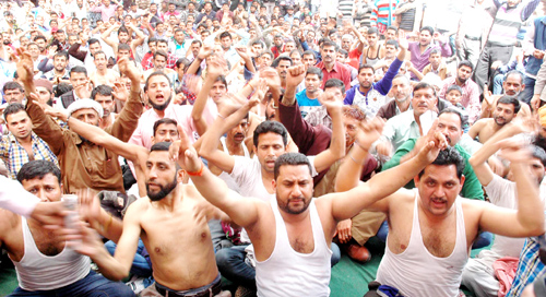Semi-naked PHE daily rated, ITI and CP workers staging protest at BC Road in Jammu on Wednesday. -Excelsior/ Rakesh Semi-naked PHE daily rated, ITI and CP workers staging protest at BC Road in Jammu on Wednesday. -Excelsior/ Rakesh