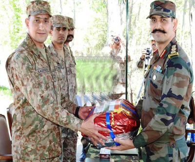 India and Pakistan Army officials shake hands before meeting at Chakan-Da-Bagh in Poonch on Tuesday. -Excelsior/Harbhajan India and Pakistan Army officials shake hands before meeting at Chakan-Da-Bagh in Poonch on Tuesday. -Excelsior/Harbhajan