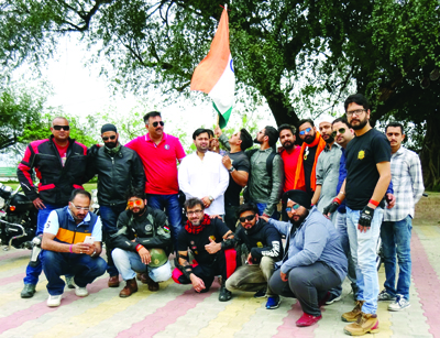Participants of Bullet Motorcycle Rally posing for group photograph. Participants of Bullet Motorcycle Rally posing for group photograph.