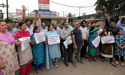 Irate parents raising slogans at Jammu on Wednesday. -Excelsior/ Rakesh Irate parents raising slogans at Jammu on Wednesday. -Excelsior/ Rakesh