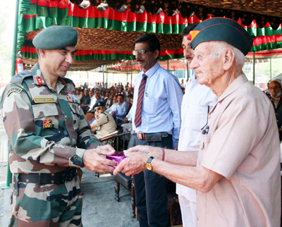 An ex-serviceman being honoured during veterans rally at Kalakote on Wednesday. An ex-serviceman being honoured during veterans rally at Kalakote on Wednesday.