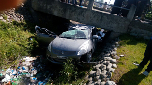 Swift car which met with an accident at Dobiwan Kunzar on Sunday. -Excelsior/Aabid Nabi Swift car which met with an accident at Dobiwan Kunzar on Sunday. -Excelsior/Aabid Nabi