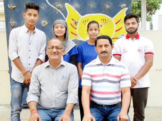 Sports climber posing for group photograph. Sports climber posing for group photograph.