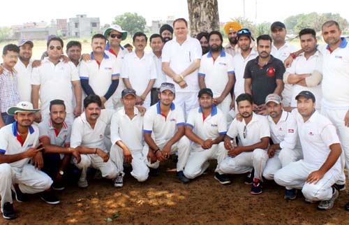 Participants of friendly cricket match posing for group photograph. Participants of friendly cricket match posing for group photograph.
