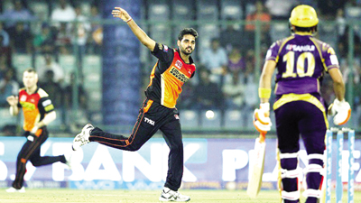 Bhuvneshwar Kumar celebrating after taking wicket against Kolkata Knight Riders in the eliminator at New Delhi. Bhuvneshwar Kumar celebrating after taking wicket against Kolkata Knight Riders in the eliminator at New Delhi.