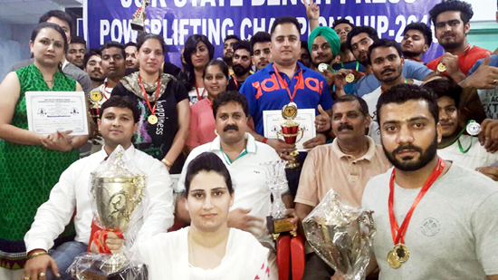 Winners of State Bench-Press Power Lifting Championship posing for group photograph. Winners of State Bench-Press Power Lifting Championship posing for group photograph.