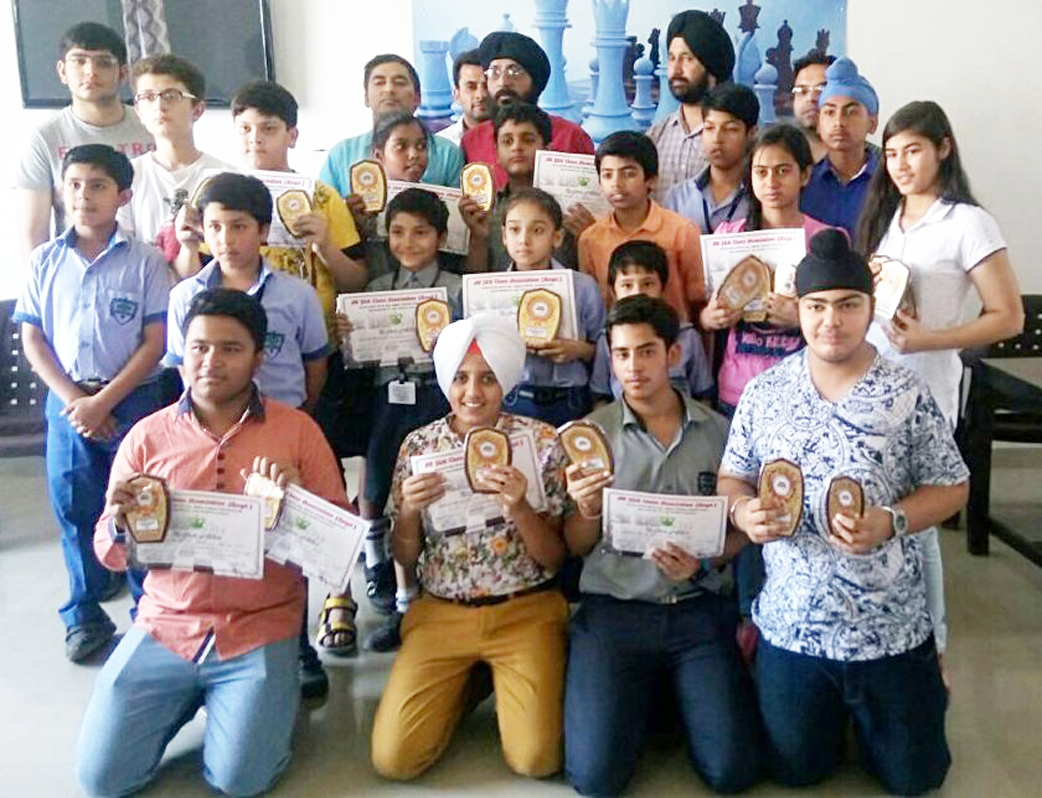 Winners of various chess events posing for a group photograph during valedictory function. Winners of various chess events posing for a group photograph during valedictory function.