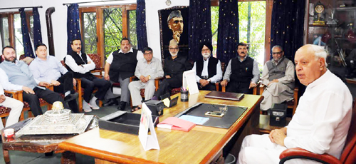 NC president Dr Farooq Abdullah presiding over the party meeting in Srinagar on Tuesday. NC president Dr Farooq Abdullah presiding over the party meeting in Srinagar on Tuesday.