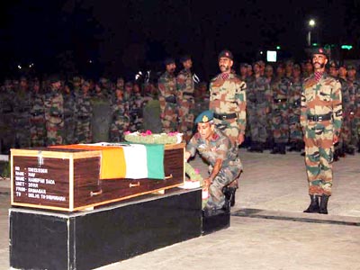 Army personnel paying floral tributes to Havildar Hangpan Dada at Badami Bagh in Srinagar on Saturday. Army personnel paying floral tributes to Havildar Hangpan Dada at Badami Bagh in Srinagar on Saturday.