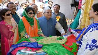 Chief Minister Mehbooba Mufti and Union MSME Minister Kalraj Mishra inspecting a stall at Khadi Exhibition on Sunday.