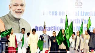 Prime Minister Narendra Modi flagging off the historic Kamakhya (Assam) to Katra (J&K) direct train by remote control, at Shillong on Friday. Also seen are Union Ministers Suresh Prabhu, Dr Jitendra Singh and Governors and Chief Ministers of Assam and Meghalaya. Prime Minister Narendra Modi flagging off the historic Kamakhya (Assam) to Katra (J&K) direct train by remote control, at Shillong on Friday. Also seen are Union Ministers Suresh Prabhu, Dr Jitendra Singh and Governors and Chief Ministers of Assam and Meghalaya.