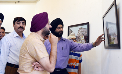 Deputy Commissioner Jammu Simrandeep Singh going through Exhibition of Heritage Structures in Jammu on Saturday. Deputy Commissioner Jammu Simrandeep Singh going through Exhibition of Heritage Structures in Jammu on Saturday.