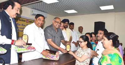 BJP leaders giving away prizes to students at Jammu on Friday. BJP leaders giving away prizes to students at Jammu on Friday.
