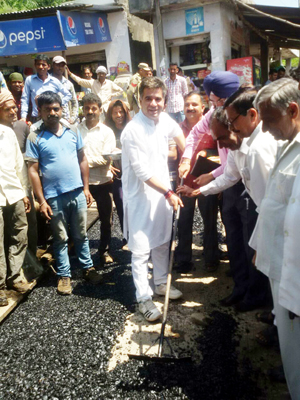 MLA Nowshera Ravinder Raina kick starting blacktopping of road at Siot on Tuesday. MLA Nowshera Ravinder Raina kick starting blacktopping of road at Siot on Tuesday.