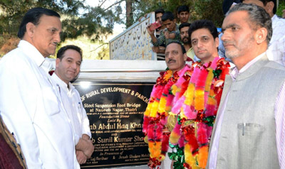 Minister for Rural Development Abdul Haq Khan laying foundation stone of steel suspension bridge in Doda on Monday. Minister for Rural Development Abdul Haq Khan laying foundation stone of steel suspension bridge in Doda on Monday.