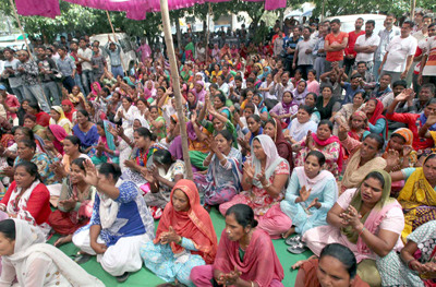 Municipal employees raising slogans during protest at JMC complex on Friday. Municipal employees raising slogans during protest at JMC complex on Friday.