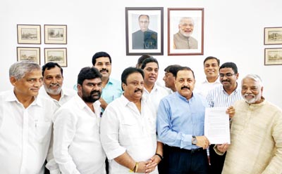 Union Minister Dr Jitendra Singh receiving a memorandum from a delegation of Telangana MPs at South Block, New Delhi on Tuesday.