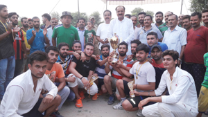 Winning team posing with trophy alongwith former Minister, S S Slathia and others. - Excelsior/Gautam