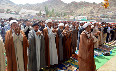 Muslims offering Eid prayers at Leh on Wednesday. -Excelsior/ Stanzin Muslims offering Eid prayers at Leh on Wednesday. -Excelsior/ Stanzin