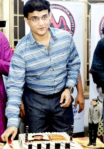 Sourav Ganguly cutting his birthday cake. Sourav Ganguly cutting his birthday cake.