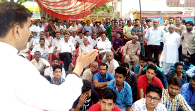 Harshdev Singh addressing a public meeting in Ramnagar on Sunday. Harshdev Singh addressing a public meeting in Ramnagar on Sunday.