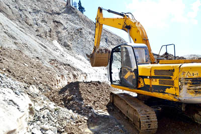 A JCB clearing landslides near Chattapani on Mughal Road in Surankote area of Poonch on Saturday. A JCB clearing landslides near Chattapani on Mughal Road in Surankote area of Poonch on Saturday.