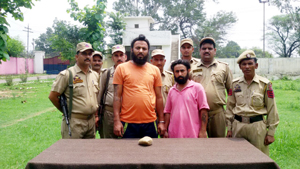 Two heroin smugglers arrested by Hiranagar police on Tuesday. -Excelsior/Madan Two heroin smugglers arrested by Hiranagar police on Tuesday. -Excelsior/Madan