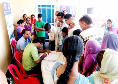 Patients waiting for their turn to get examined during medical camp by SMVD Narayana Superspeciality Hospital. Patients waiting for their turn to get examined during medical camp by SMVD Narayana Superspeciality Hospital.