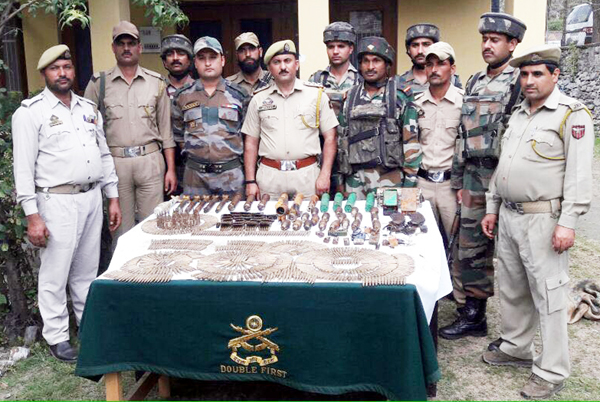 Army and police personnel pose with recoveries in Chatroo area of Kishtwar district on Wednesday.—Excelsior/Tilak Raj Army and police personnel pose with recoveries in Chatroo area of Kishtwar district on Wednesday.—Excelsior/Tilak Raj
