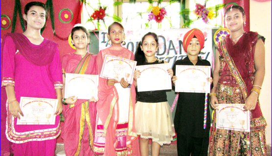 Winners of inter house solo dance competition posing for group photograph. Winners of inter house solo dance competition posing for group photograph.