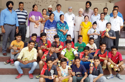 Winners and participants of Table Tennis Tournament posing for group photograph. Winners and participants of Table Tennis Tournament posing for group photograph.