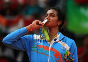P V Sindhu kissing her medal.