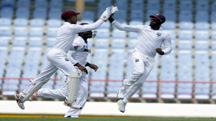 West Indies’ wicketkeeper Shane Dorwich, left, celebrates with teammate Jermaine Blackwood taking the wicket of India's Shikhar Dhawan on day one of their third cricket Test match at the Daren Sammy Cricket Ground in Gros Islet, St. Lucia, Tuesday. West Indies’ wicketkeeper Shane Dorwich, left, celebrates with teammate Jermaine Blackwood taking the wicket of India's Shikhar Dhawan on day one of their third cricket Test match at the Daren Sammy Cricket Ground in Gros Islet, St. Lucia, Tuesday.