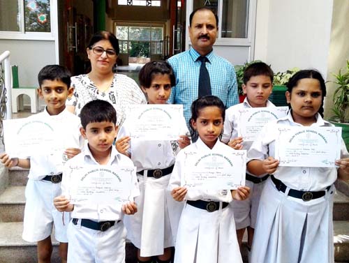 Winners of word building competition posing for group photograph. Winners of word building competition posing for group photograph.